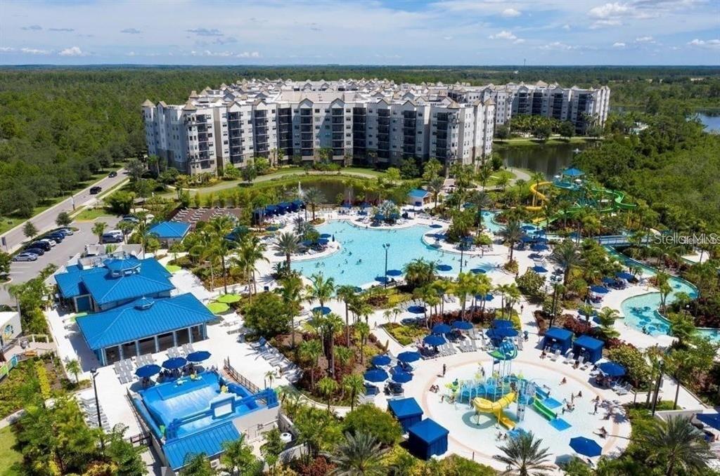 An aerial view of a large resort complex featuring a swimming pool and water park — 14501 GROVE RESORT AVENUE UNIT 3222, WINTER GARDEN, FL