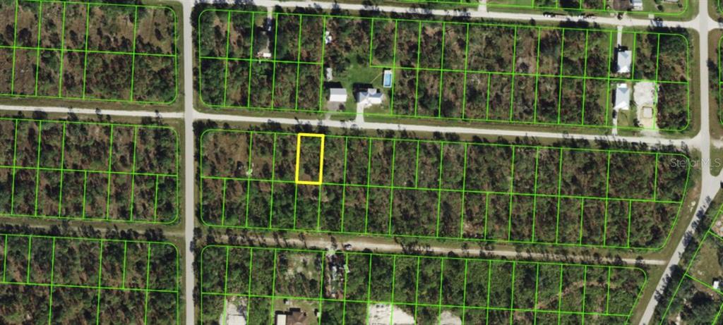 An aerial map view shows a highlighted rectangular plot of land in a residential area — 27421 MANDALAY DRIVE, PUNTA GORDA, FL