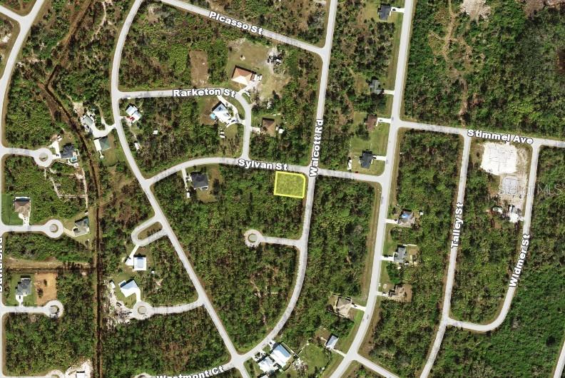 This is an aerial map showing a vacant corner lot highlighted in yellow — 12397 SYLVAN STREET, PORT CHARLOTTE, FL