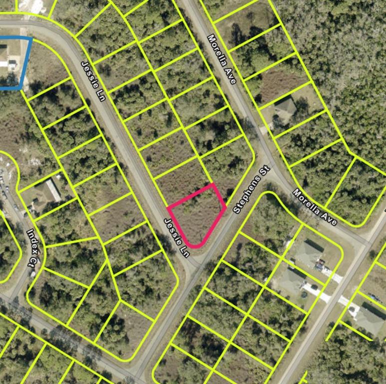 This is an aerial map showing a vacant, pink-outlined lot situated between two paved roads — 638 JESSIE LANE, LEHIGH ACRES, FL