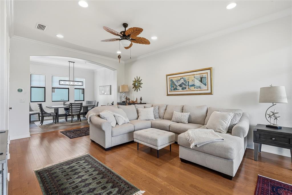 A kitchen with dark wood cabinets and a dining area with a rectangular table — 4815 YACHT CLUB DRIVE UNIT 102, TAMPA, FL
