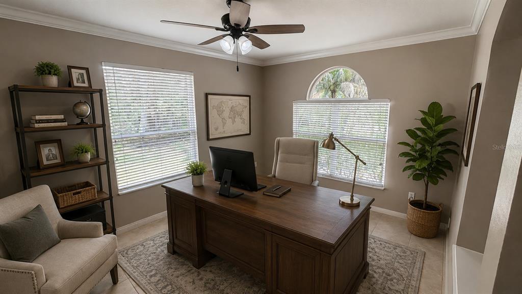 A home office features a wooden desk, an armchair, a bookshelf, and two windows — 4613 RIVER OVERLOOK DRIVE, VALRICO, FL