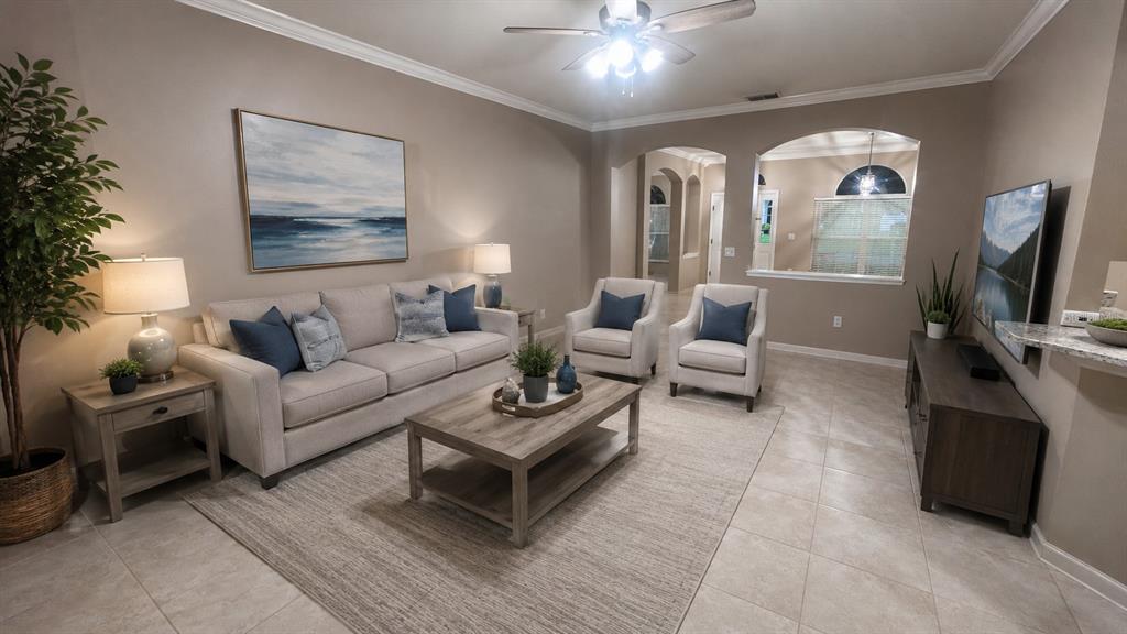 A living room features a beige sofa, two armchairs, a coffee table, and tile flooring — 4613 RIVER OVERLOOK DRIVE, VALRICO, FL