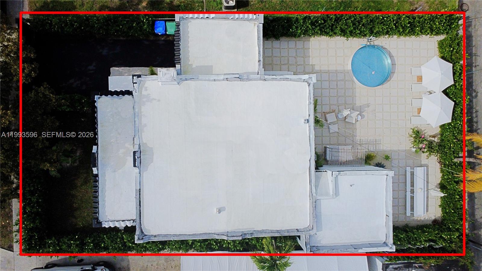 An aerial view shows a flat-roofed house with a backyard pool and patio area — 745 NW 47th Ter, Miami FL 33127, MIAMI, FL