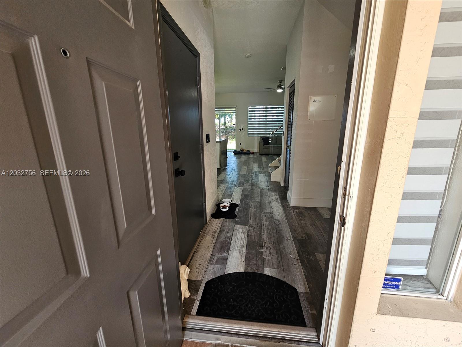 The view from an open front door reveals a hallway with wood-look flooring — 4331 SW 124th Way, Miramar FL 33027, MIRAMAR, FL