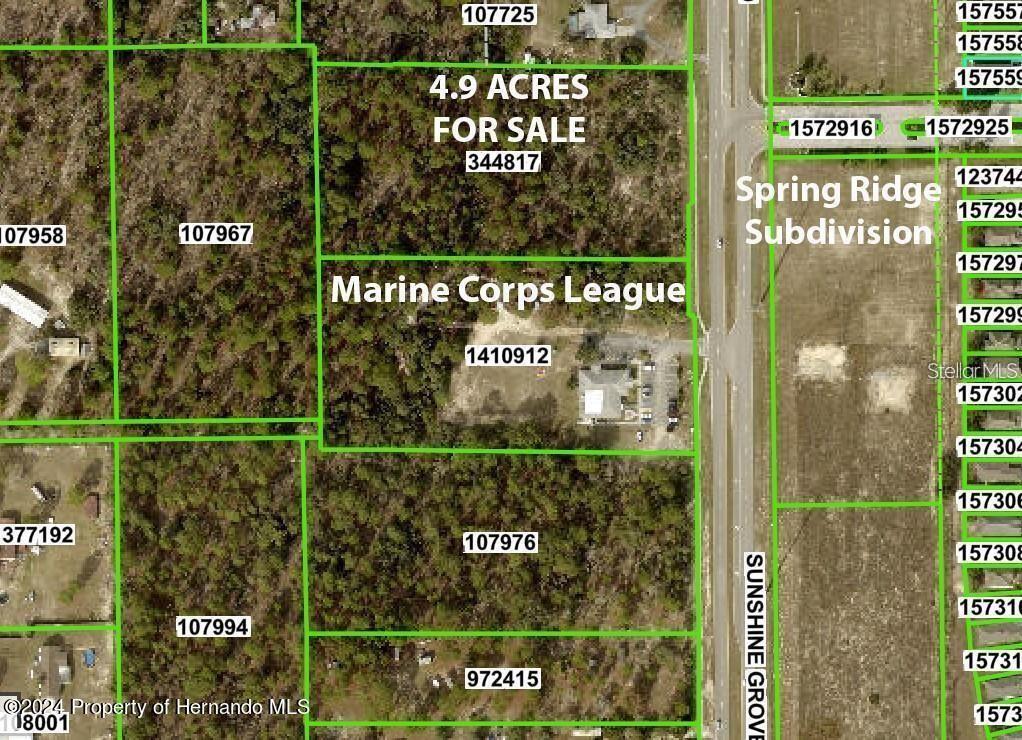 This is an aerial map showing a 4.9-acre property for sale near Sunshine Grove Road — SUNSHINE GROVE ROAD, BROOKSVILLE, FL