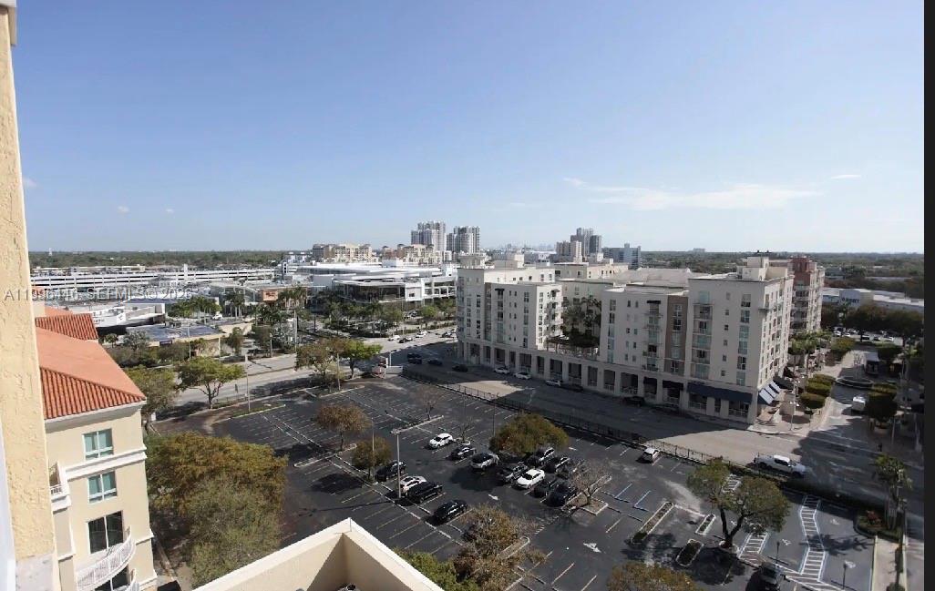 An elevated view of a parking lot and surrounding apartment buildings under a clear sky — 7350 SW 89th St # 1102S, Miami FL 33156, MIAMI, FL