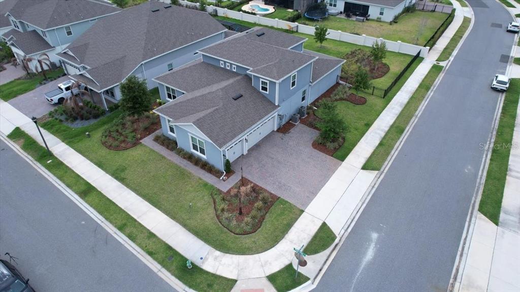 A two-story house with light blue siding, a two-car garage, and a landscaped front yard — 15363 WILLOW RIDGE DRIVE, MONTVERDE, FL