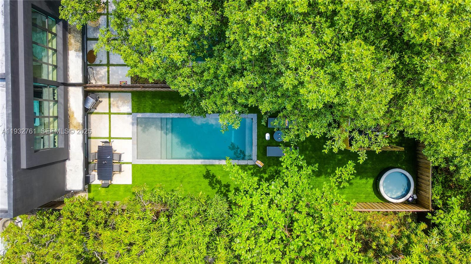 An aerial view shows a rectangular swimming pool, a circular hot tub, and a dining area — 58 NW 52nd St, Miami FL 33127, MIAMI, FL