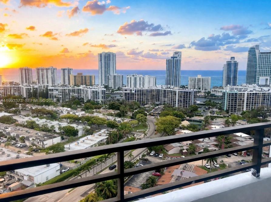 A high-angle view of a coastal city skyline at sunset from a balcony — 2500 Parkview Dr # 2206, Hallandale Beach FL 33009, HALLANDALE BEACH, FL