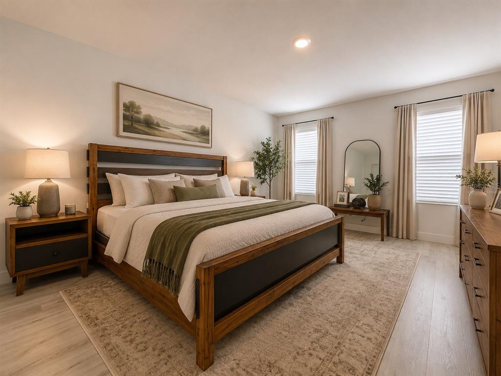A bedroom features a wooden bed frame, two nightstands, a dresser, and two windows — 4020 LIVELY CORAL PLACE, BRADENTON, FL