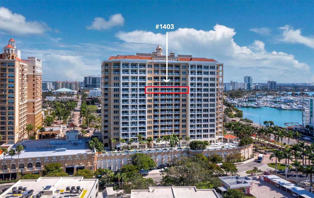 An aerial view shows a tall residential building with a highlighted balcony on the fourteenth floor — 35 WATERGATE DRIVE UNIT 1403, SARASOTA, FL
