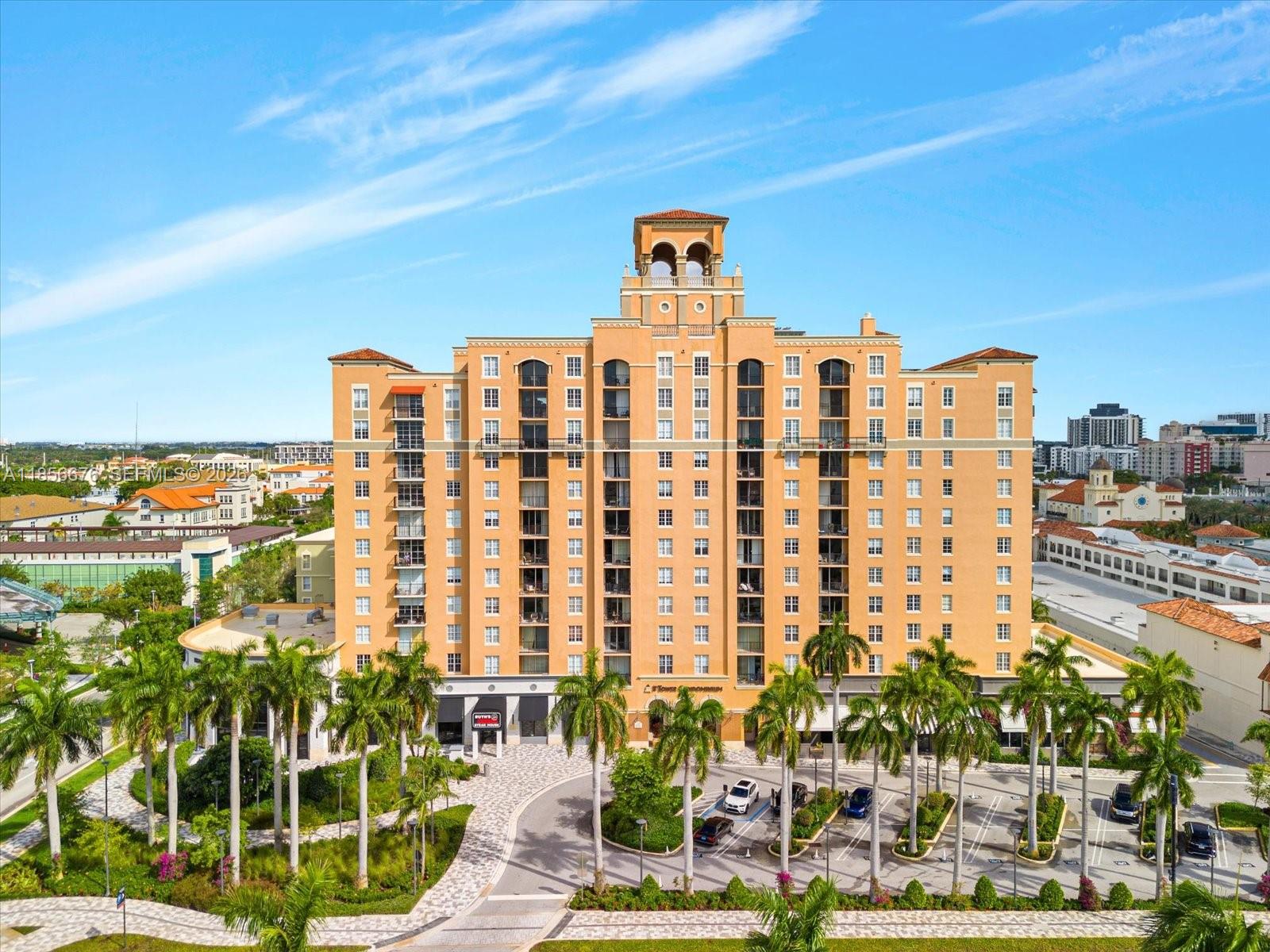 An elevated view shows a modern building, a fountain, palm trees, and surrounding streets — 651 Okeechobee Blvd # 1002, West Palm Beach FL 33401, WEST PALM BEACH, FL