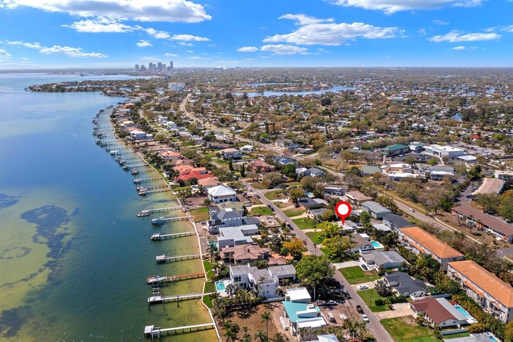 An aerial view shows a waterfront residential neighborhood with a red marker on a house — 4540 BAYSHORE BOULEVARD NE, ST PETERSBURG, FL
