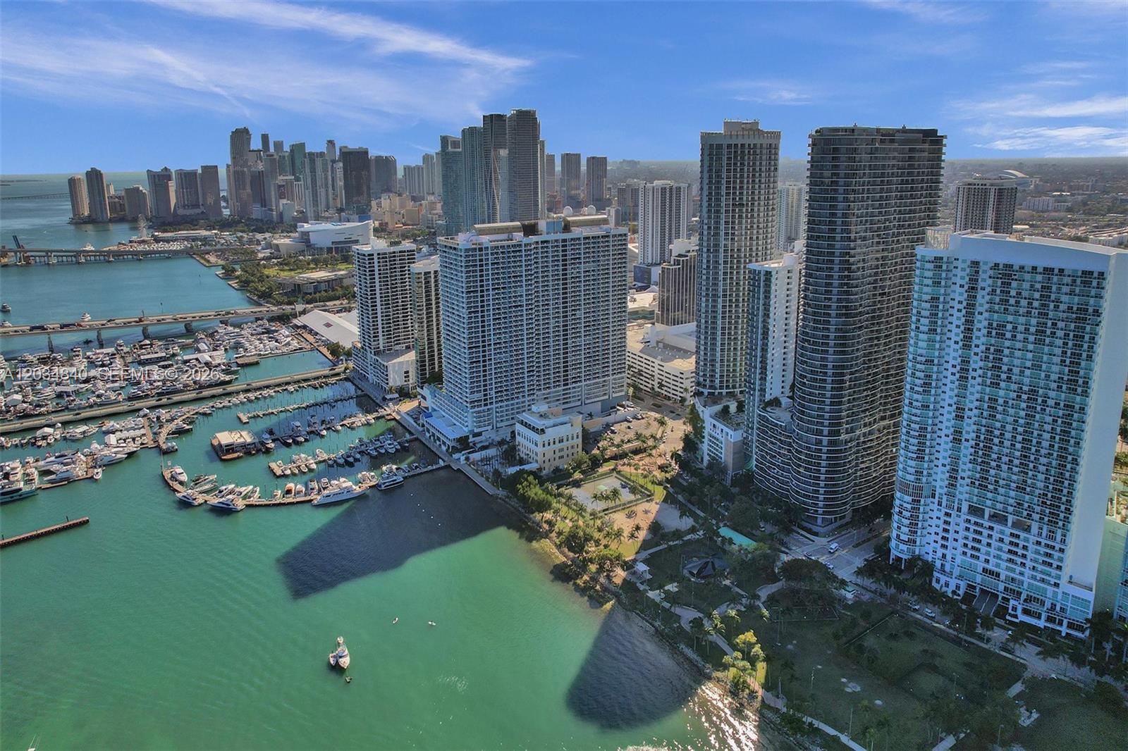 An aerial view of the Miami skyline featuring high-rise buildings, a marina, and a park — 1750 N Bayshore Dr # 3802, Miami FL 33132, MIAMI, FL