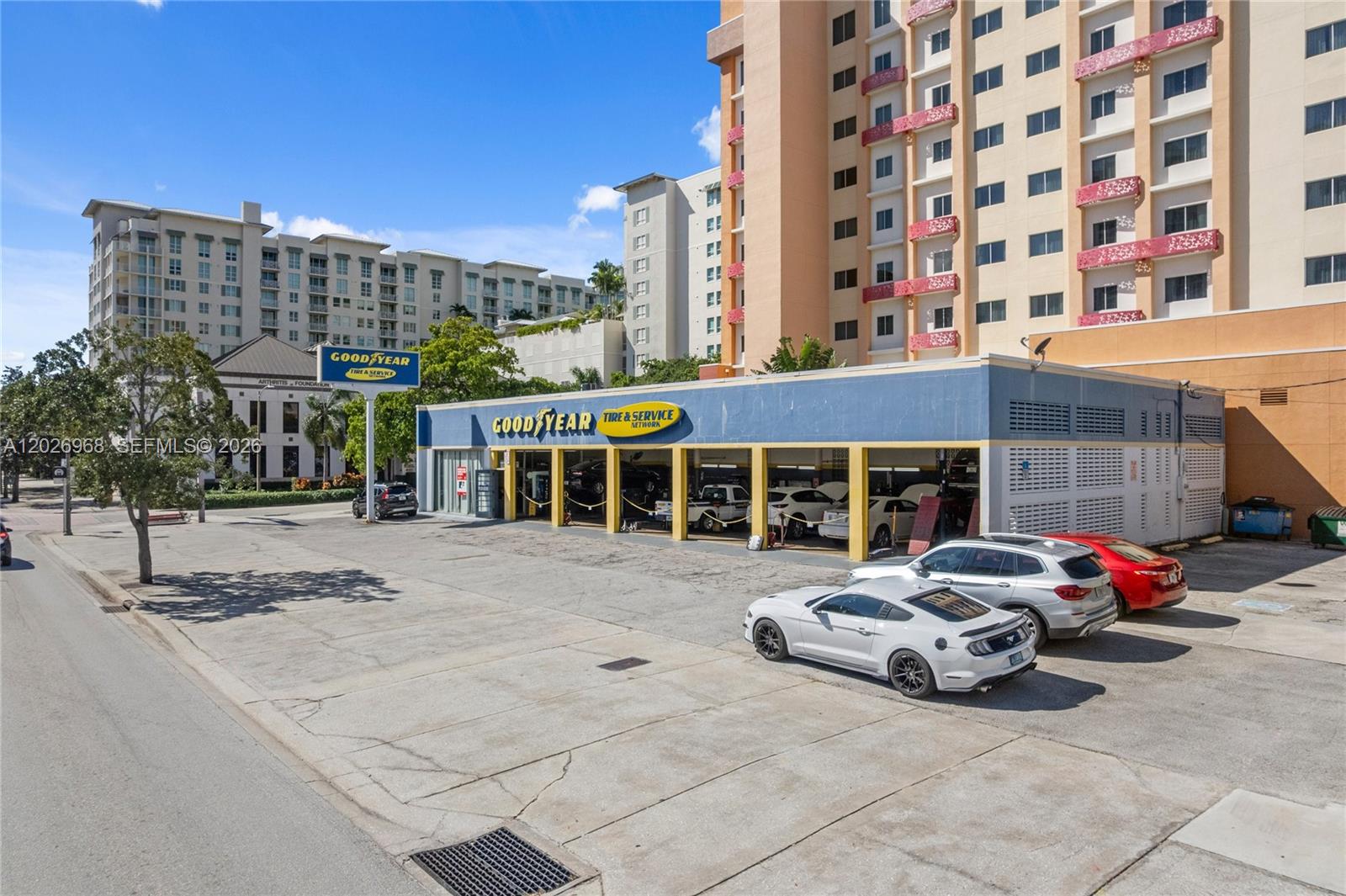 An exterior view of a Goodyear auto service center with a large parking lot — 515 S Dixie Hwy, West Palm Beach FL 33401, WEST PALM BEACH, FL