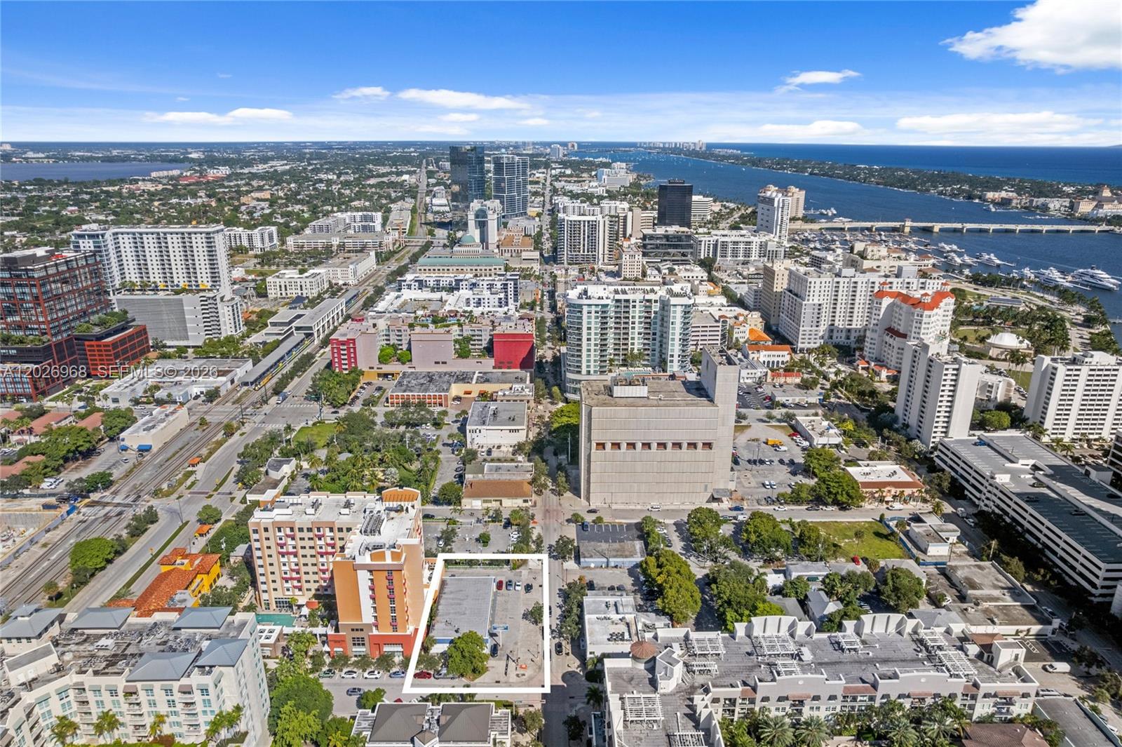 An aerial view shows a city skyline with a highlighted rectangular lot in the foreground — 515 S Dixie Hwy, West Palm Beach FL 33401, WEST PALM BEACH, FL