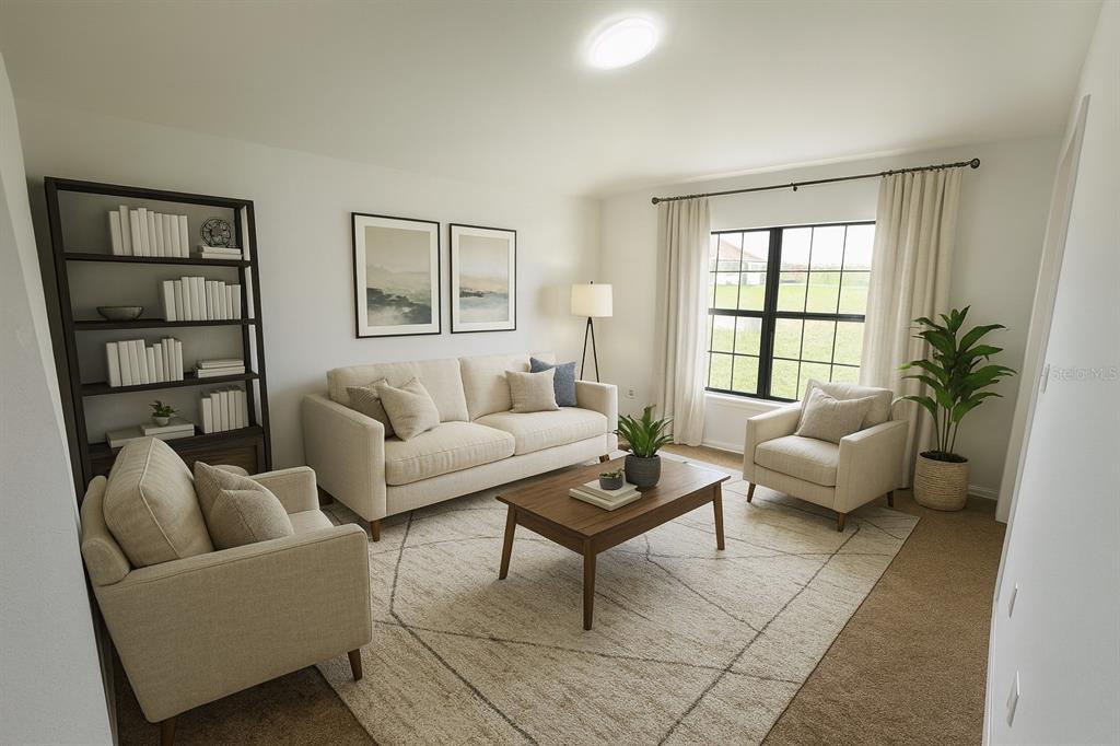 This living room features a beige sofa, two armchairs, a coffee table, and a bookshelf — 540 CENTRAL RIDGE LANE, FROSTPROOF, FL
