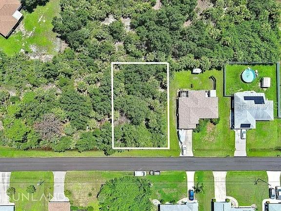 An aerial view shows a rectangular vacant lot outlined in white between two residential properties — 6264 BROOKRIDGE STREET, ENGLEWOOD, FL