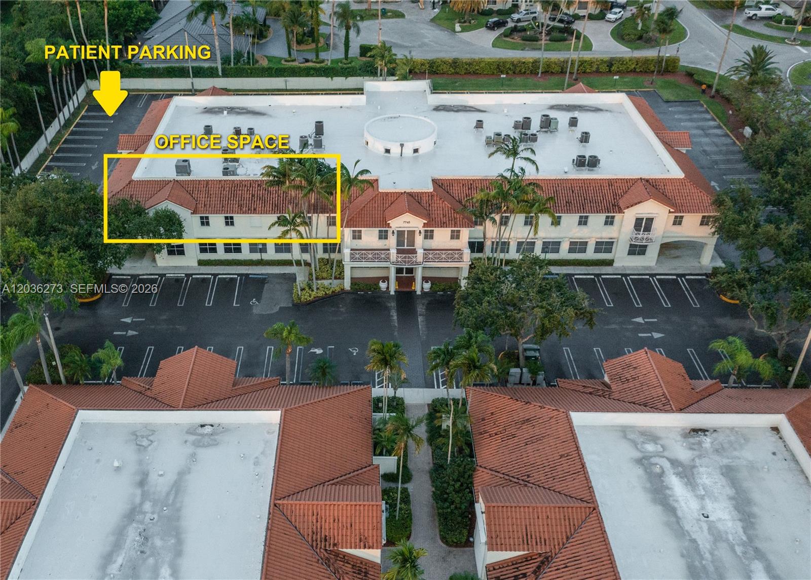 An aerial view shows a two-story commercial building with a red tile roof and parking — 7765 SW 87th Ave # 212A, Miami FL 33173, MIAMI, FL