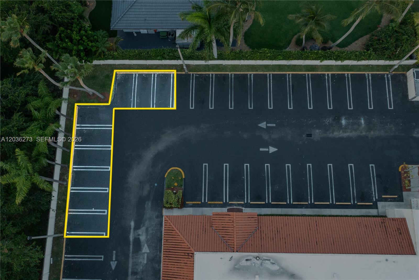 An aerial view shows a parking lot with a section of spaces highlighted in yellow — 7765 SW 87th Ave # 212A, Miami FL 33173, MIAMI, FL
