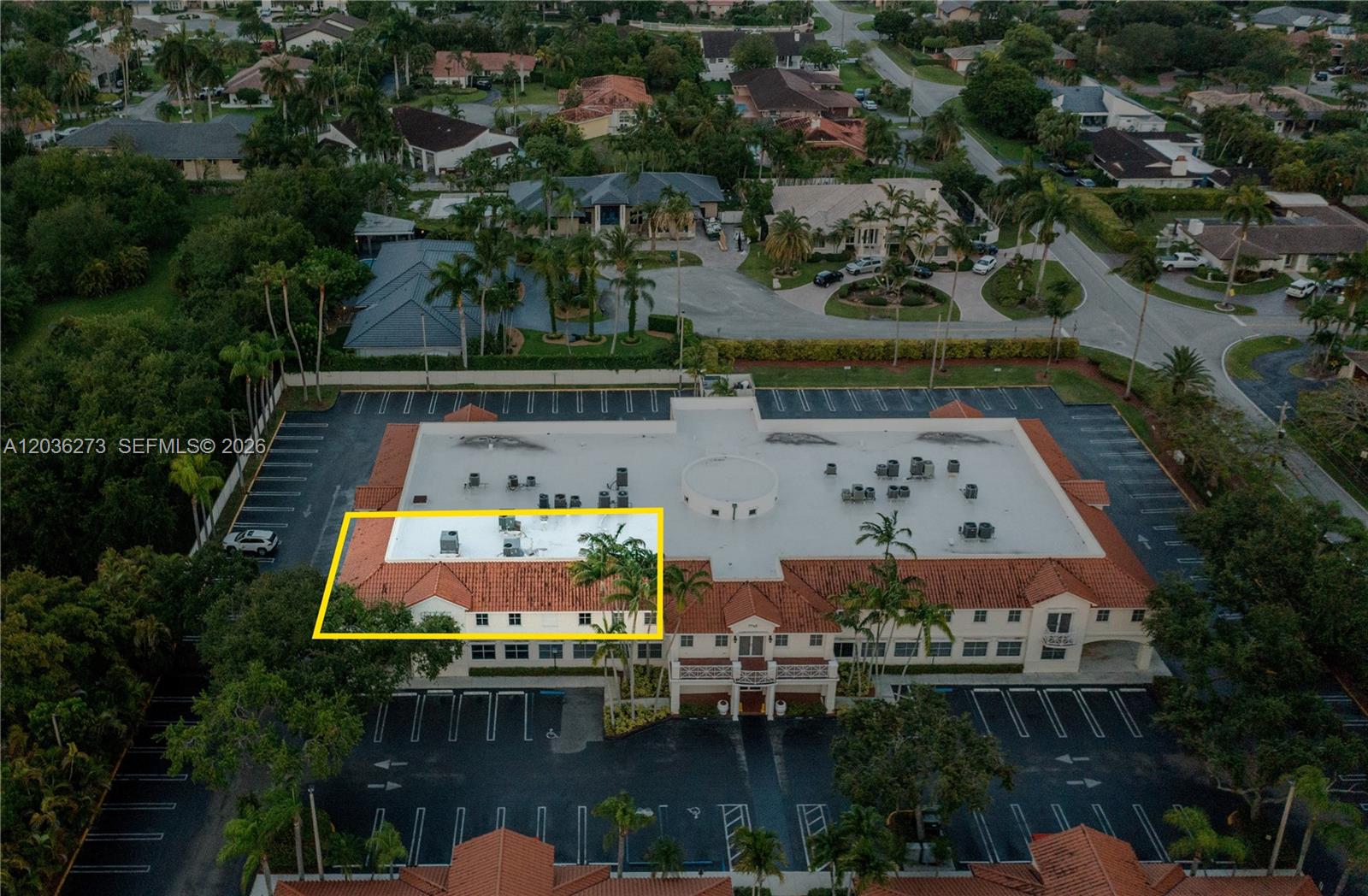 An aerial view shows a commercial building with a tiled roof and surrounding parking lot — 7765 SW 87th Ave # 212A, Miami FL 33173, MIAMI, FL