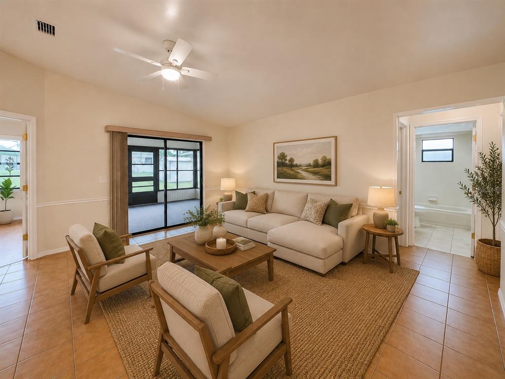 A living room features tile floors, a beige sectional, two armchairs, and a sliding glass door — 3524 BRISTOL STREET, SEBRING, FL