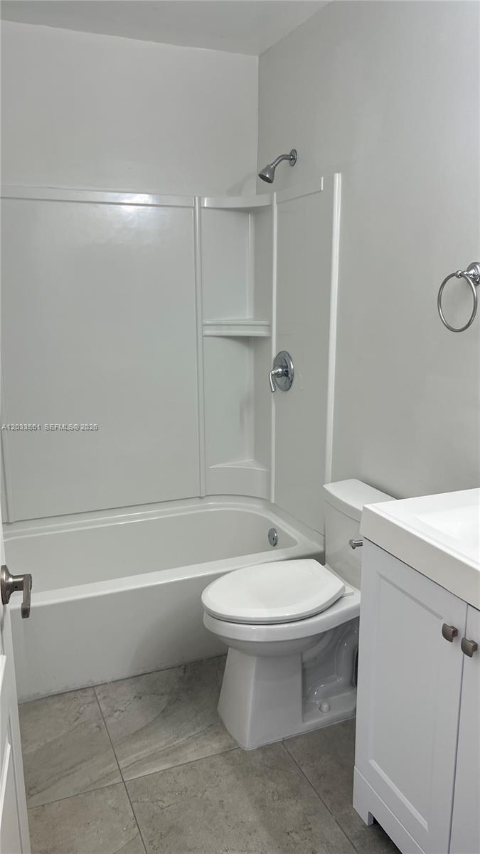 A small bathroom features a white vanity, a toilet, and a tub-shower combination — 6225 Kendale Lakes Cir # 263, Miami FL 33183, MIAMI, FL