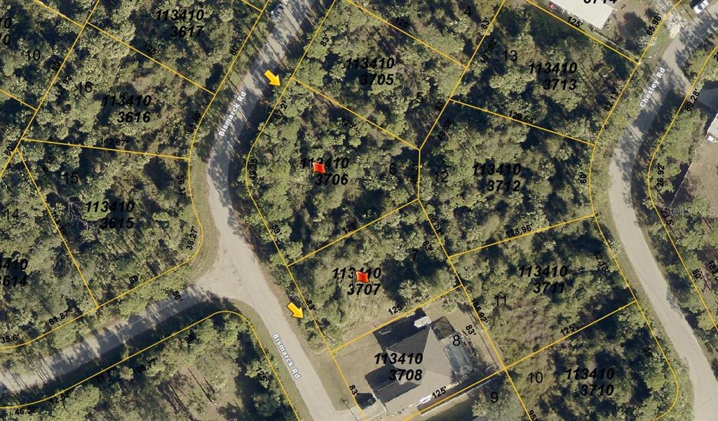 This is a satellite map showing several wooded residential lots and a house — BISMARCK ROAD, NORTH PORT, FL