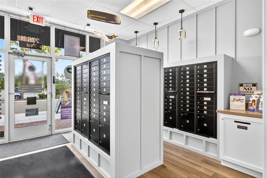 An interior view of a mail center featuring rows of black metal mailboxes — 2751 E COUNTY LINE ROAD, LUTZ, FL