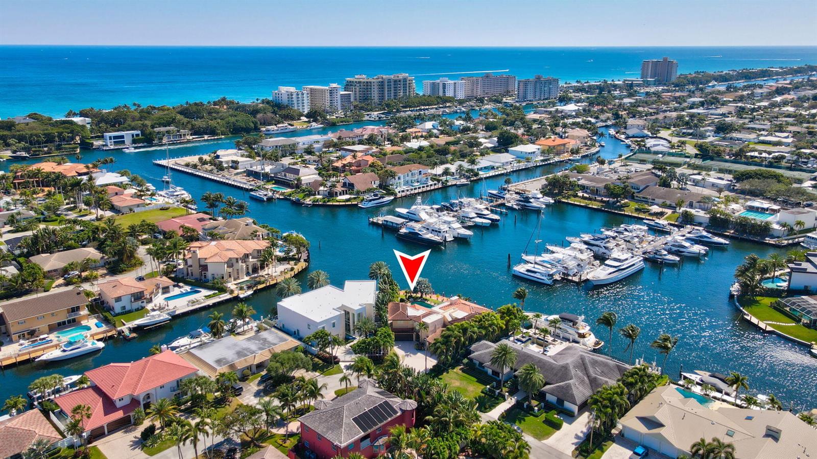 An aerial view shows a waterfront house with a red arrow pointing to the property — 2850 NE 44th Street, Lighthouse Point FL 33064, LIGHTHOUSE POINT, FL