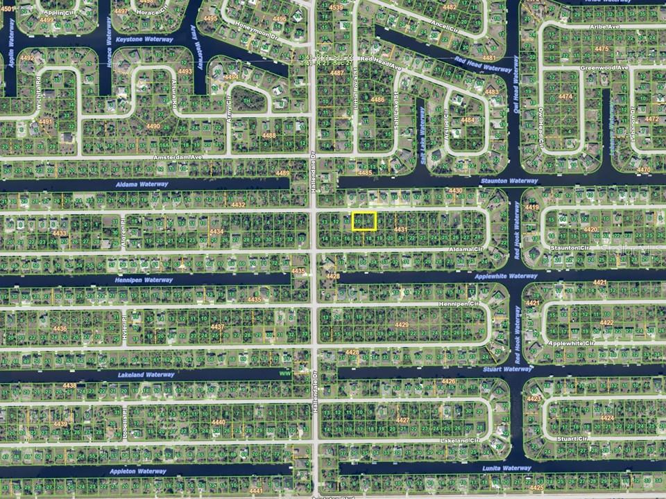 This is a map showing residential lots and waterways in a suburban neighborhood — 15825 ALDAMA CIRCLE, PORT CHARLOTTE, FL