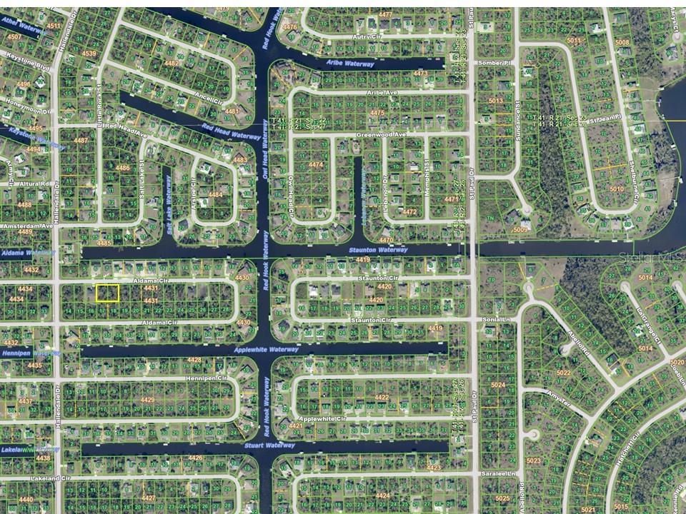 This is a map showing a residential neighborhood with streets, waterways, and individual property lots — 15825 ALDAMA CIRCLE, PORT CHARLOTTE, FL