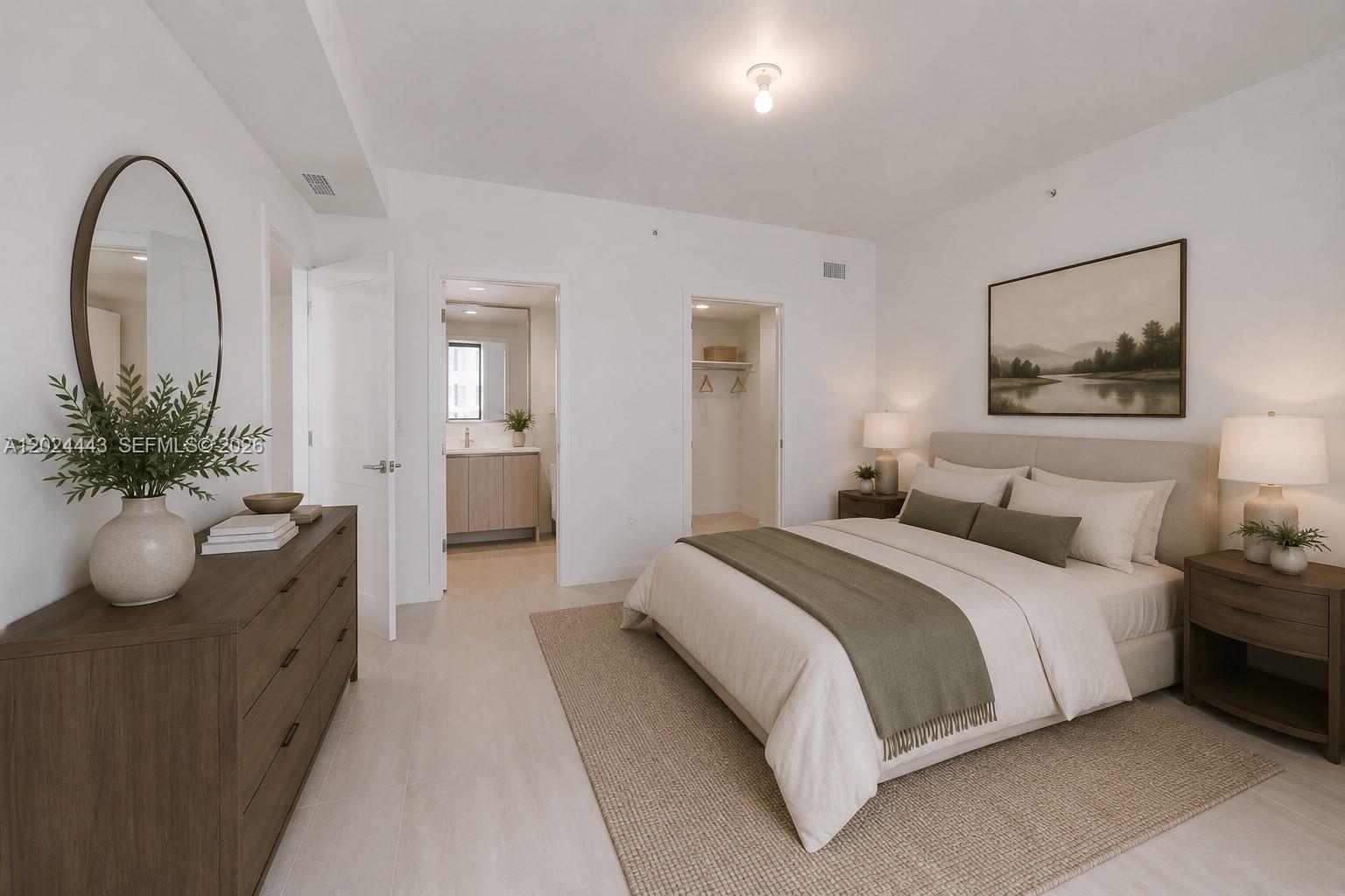 A bedroom features a bed with a green throw, a dresser, and two doorways — 77 SE 5th st # 2305, Miami FL 33131, MIAMI, FL