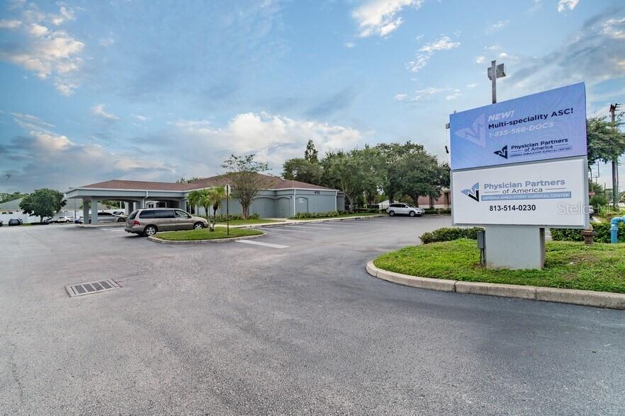 An exterior view of a medical office building with a parking lot and signage — 4703 N ARMENIA AVENUE, TAMPA, FL