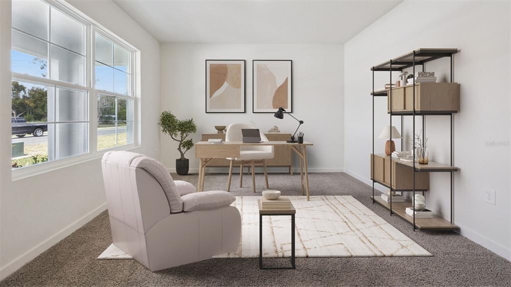 A home office features a desk, armchair, shelving unit, and large windows with outdoor views — 1120 GULL DRIVE, APOPKA, FL