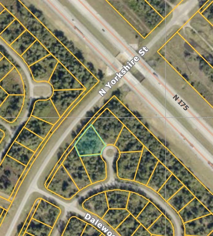 This is an aerial map view showing a highlighted vacant lot within a residential subdivision — DADE COURT, NORTH PORT, FL