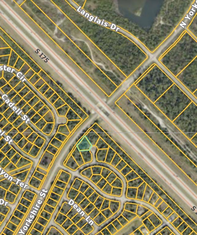 This is an aerial map showing a vacant lot highlighted in a residential neighborhood — DADE COURT, NORTH PORT, FL