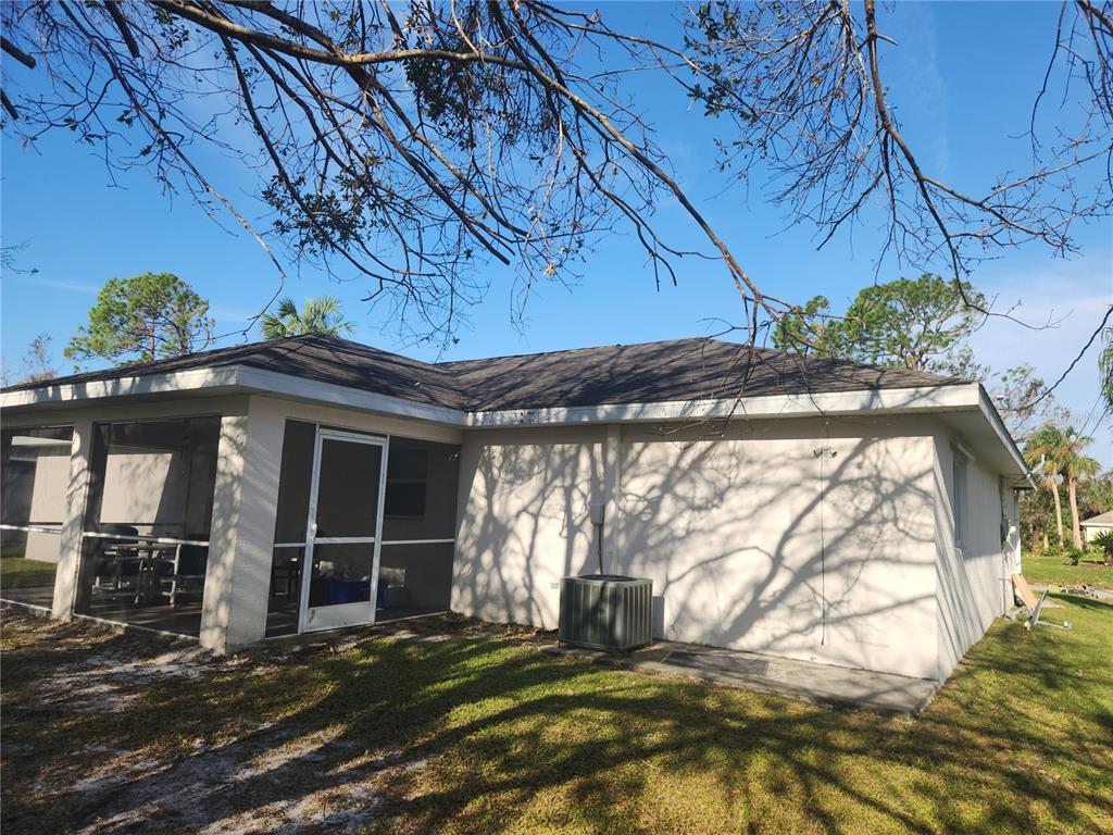 An empty room with light-colored walls, a large arched window, and wood-look tile flooring — 4254 CYNTHIA TERRACE, NORTH PORT, FL