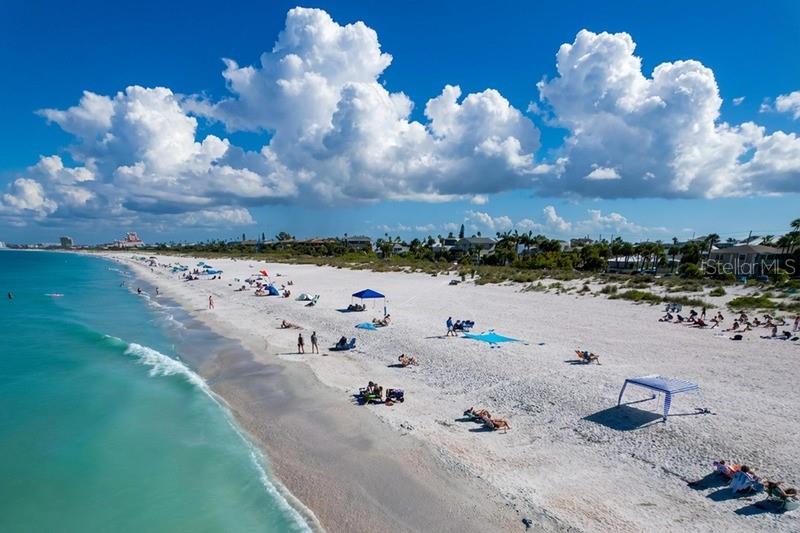 An aerial view of a white sand beach with people, umbrellas, and turquoise water — 1800 PASS-A-GRILLE WAY UNIT 2, ST PETE BEACH, FL