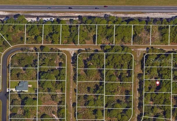 An aerial map view shows a residential lot marked with a pin among wooded parcels — TROLLEY ROAD Lot 3, NORTH PORT, FL