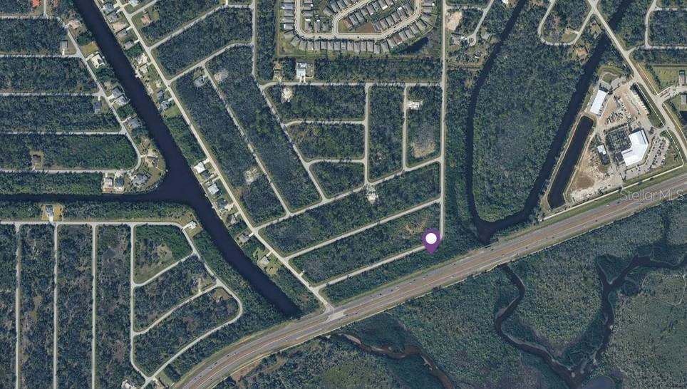 This is an aerial map view of a vacant residential lot marked with a pin — 2278 GRAMERCY STREET, PORT CHARLOTTE, FL