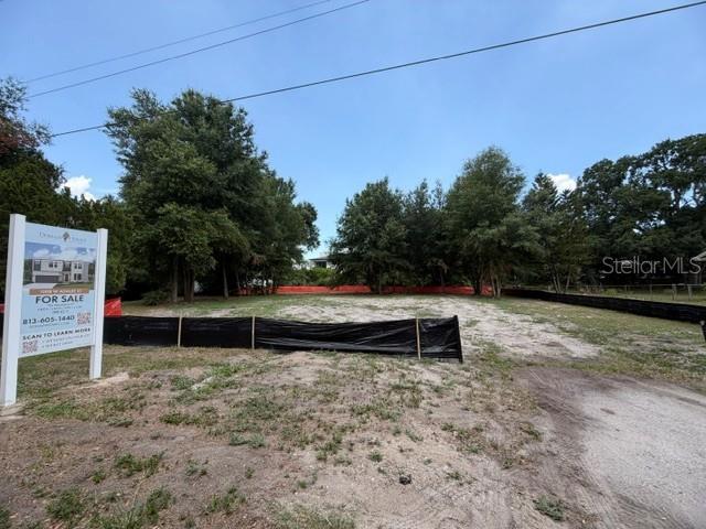 A vacant, cleared residential lot features a for-sale sign and black silt fencing — 1008 W ADALEE STREET, TAMPA, FL