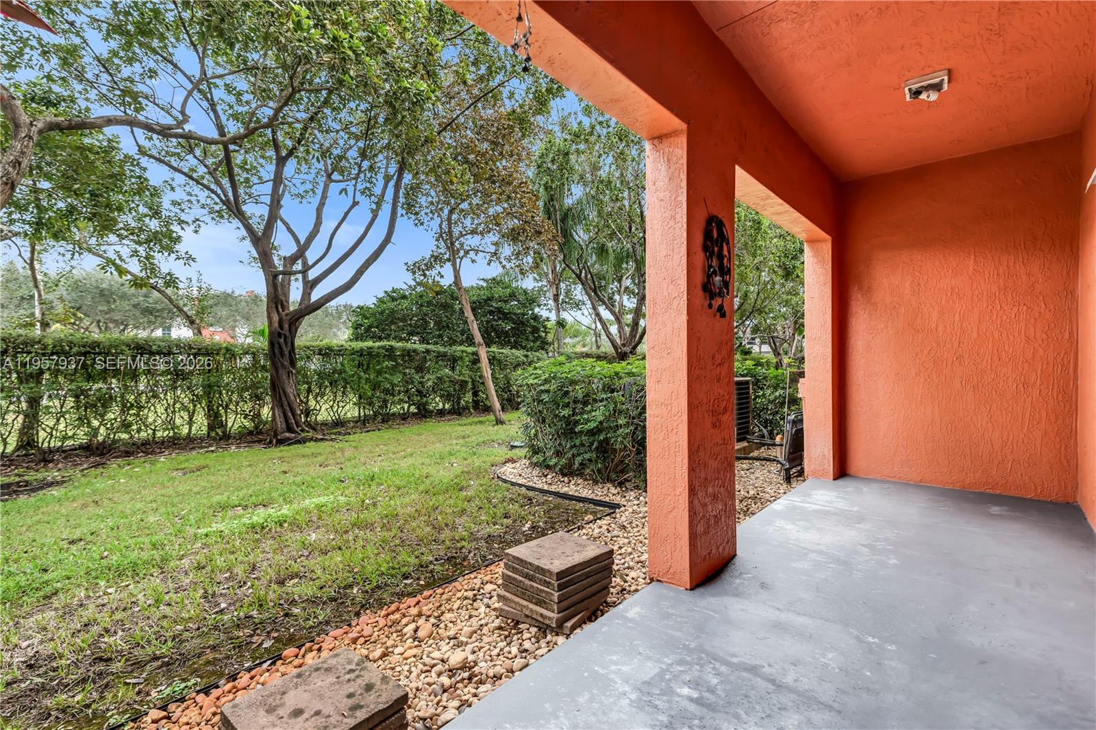 A kitchen features white cabinets, stainless steel appliances, and dark granite countertops — 7401 Palomino Dr # 1, Davie FL 33024, DAVIE, FL