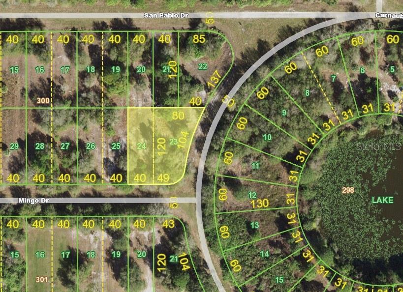 This is a map showing a highlighted vacant residential lot situated near a lake — 27102 MINGO DRIVE, PUNTA GORDA, FL