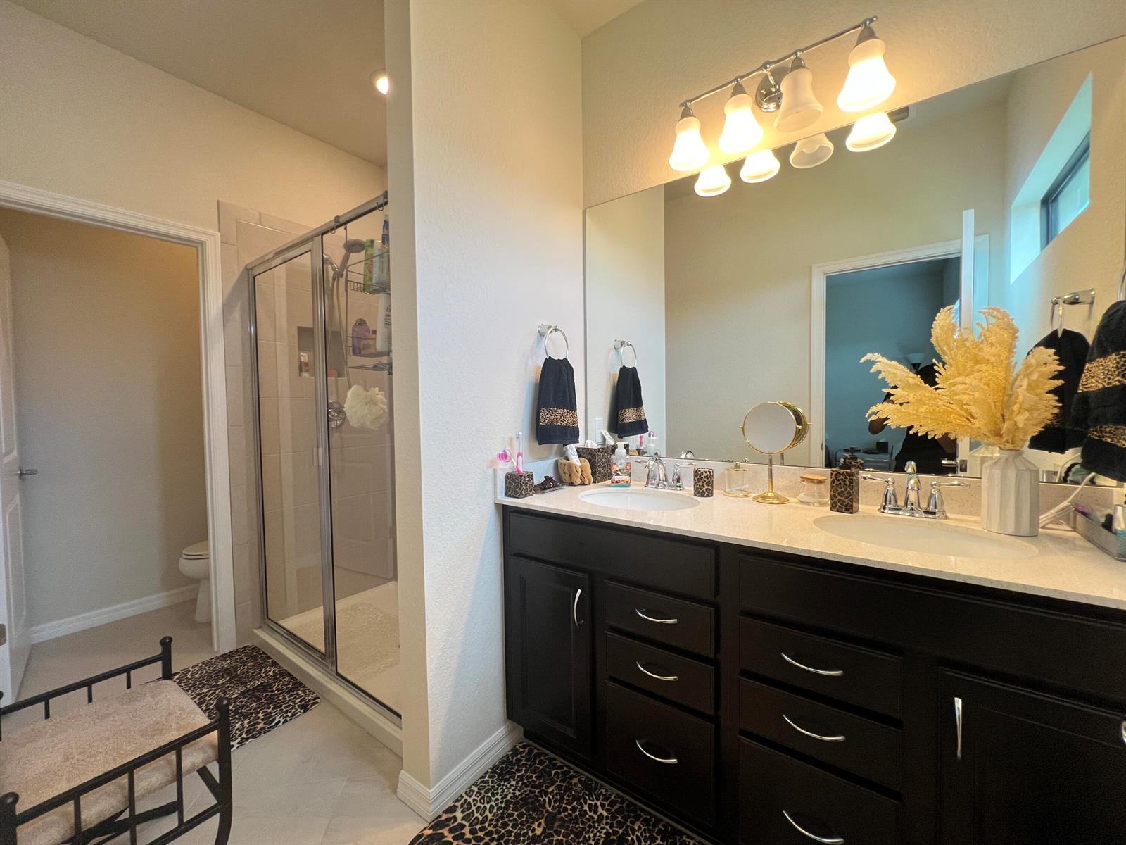 A swimming pool with a hot tub is surrounded by lounge chairs and a patio — 4843 Indio Trail, Lake Worth FL 33467, LAKE WORTH, FL