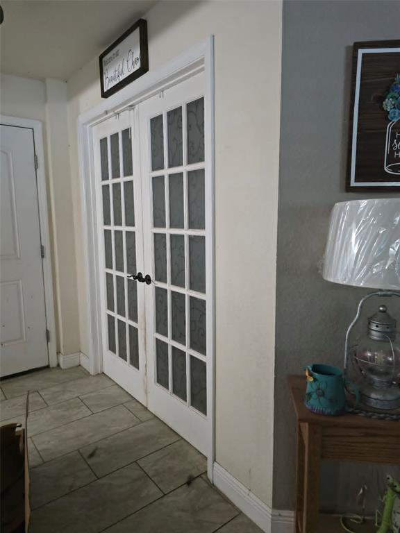 A covered entryway features a screen door, a lawnmower, and a portable basketball hoop — 1982 WINSLOW LANE, NORTH PORT, FL
