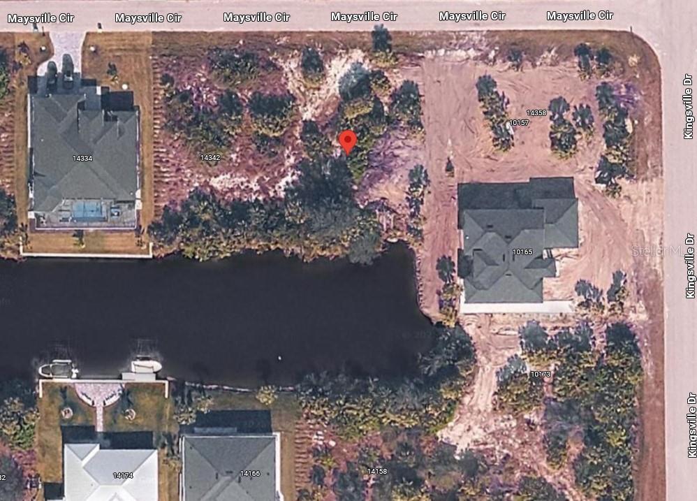 This aerial map shows a vacant residential lot situated between two houses near a pond — 14350 MAYSVILLE CIRCLE, PORT CHARLOTTE, FL