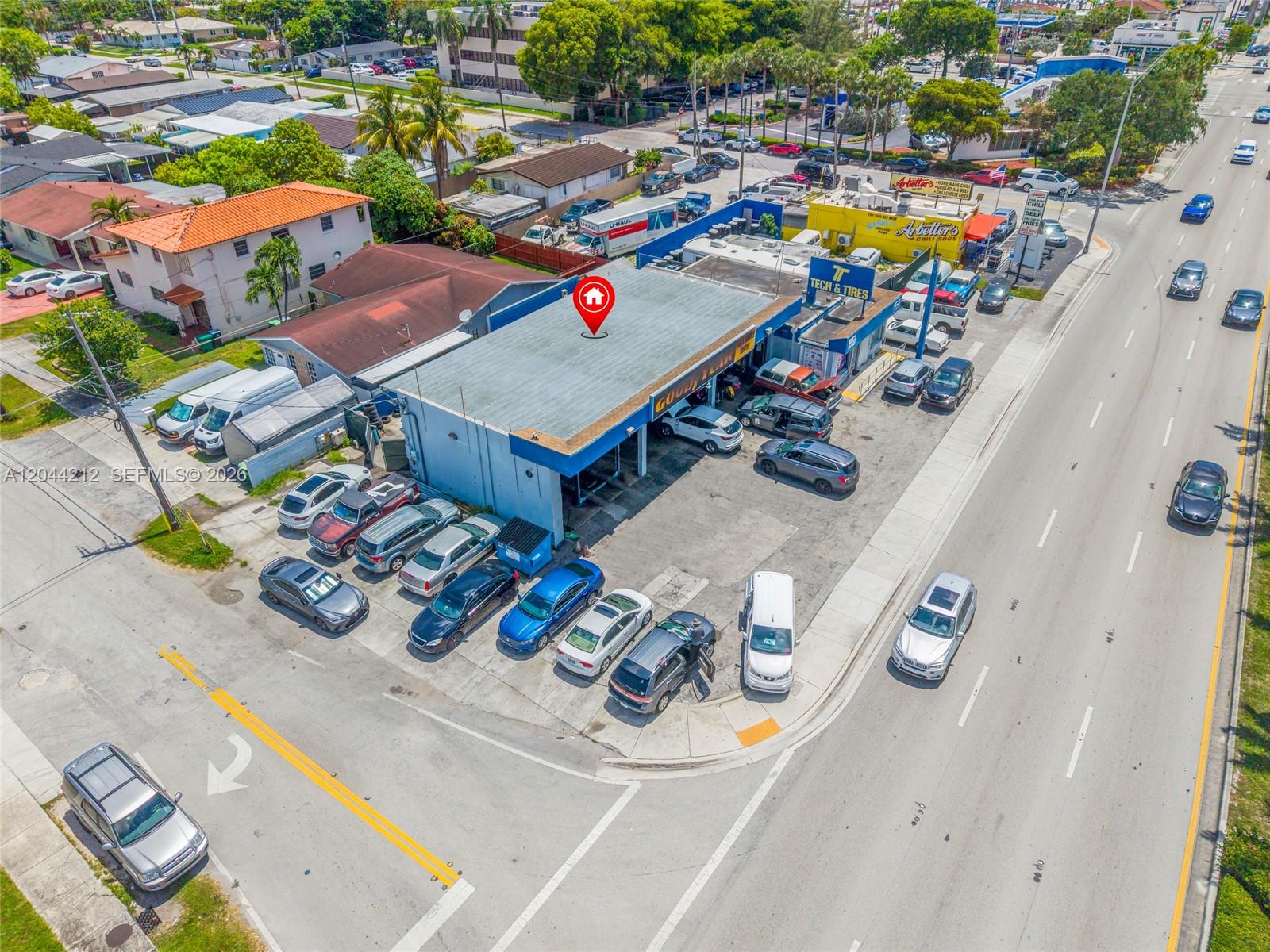 An aerial view shows a commercial auto repair shop with a parking lot and surrounding streets — 8765 Bird Rd, Miami FL 33165, MIAMI, FL