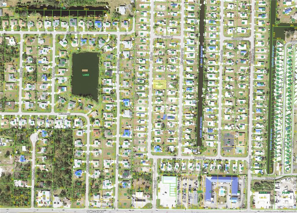 This is a map showing residential lots, streets, and a lake in a suburban area — 1409 IBIS (LOT 20) DRIVE, ENGLEWOOD, FL